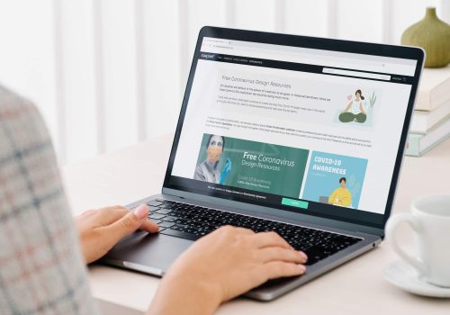 Woman checking out free design resources at a website